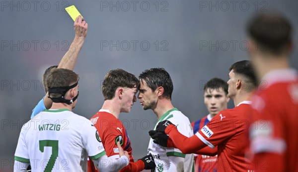 Paul Wanner 1. FC Heidenheim 1846 FCH (10) and Jordi Quintilla FC St. Gallen (08) clash Referee