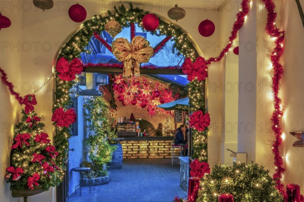 Christmas decorated passage to the mulled wine stand in the side passage at the Christmas market,