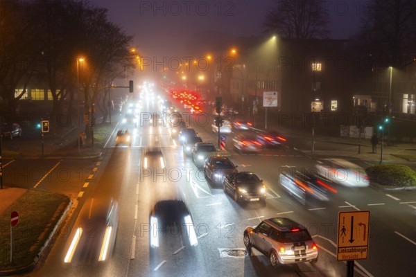 Dense fog, with visibility sometimes less than 100 metres, city centre traffic at rush hour on