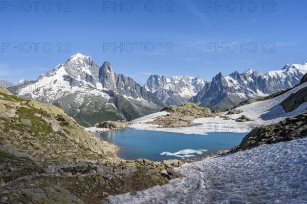 Mountain landscape with mountain lake Lac Blanc, mountain peaks, Aiguille Verte, Grandes Jorasses,