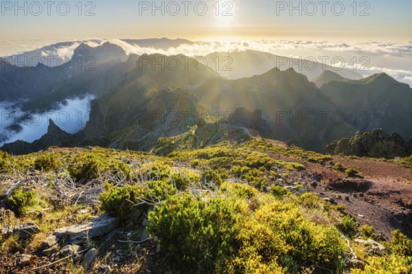 View of mountains over clouds from Pico Ruivo on sunset. Madeira island, Portugal, Europe
