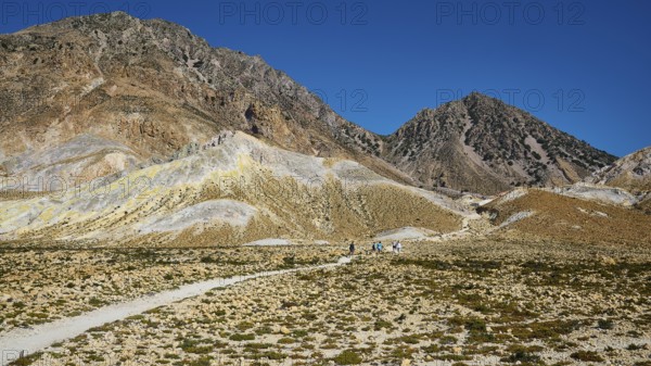 Mountain landscape with a path surrounded by rocky hills and clear sky, Volcanism, Volcanic Island,