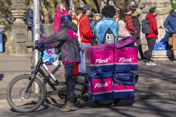 Bicycle courier of the Flink express delivery service, delivers groceries, currently in over 40