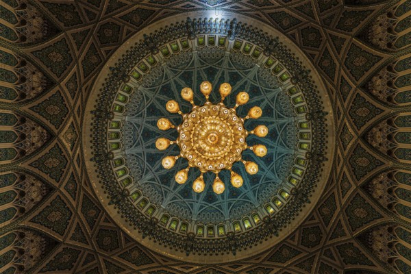 Dome and illuminated chandelier in the Sultan Qaboos Mosque, Muscat, Arabian Peninsula, Sultanate