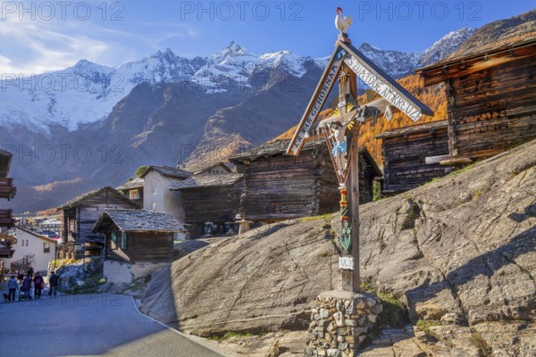 Typical Saas Valley wayside shrine and granary on the edge of the village with Dom 4545m and