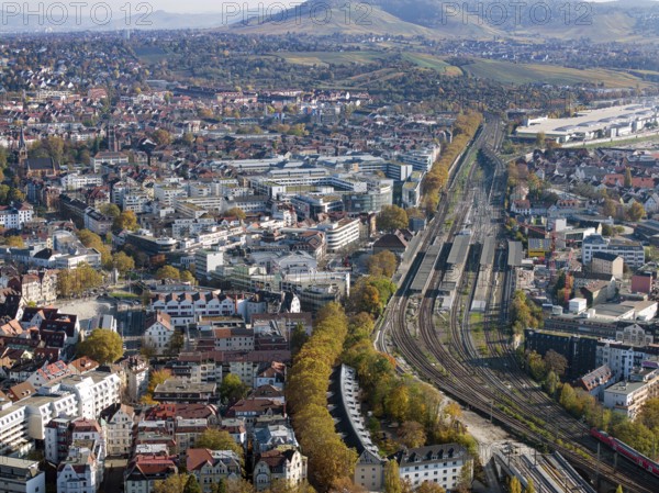 Stuttgart Bad Cannstatt with railway station, aerial view. Above it the Mercedes-Benz engine plant