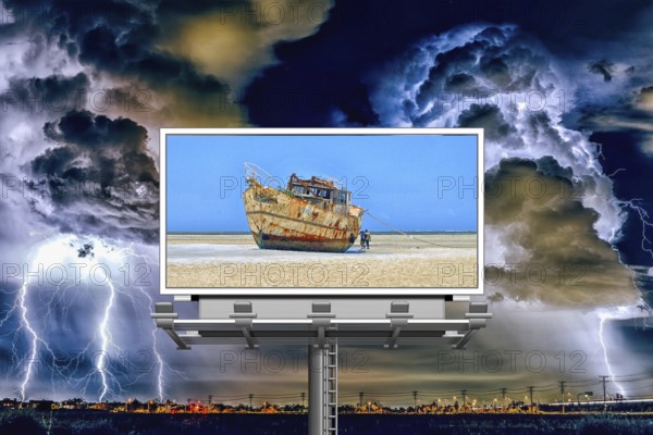 Symbolic image, storm over the city, billboard with ship on dry land, threat to paradise, water