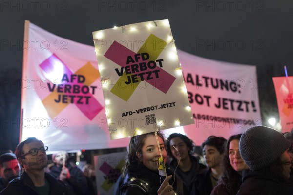 Participants with an AfD ban sign at the demonstration under the motto Sea of Lights against the