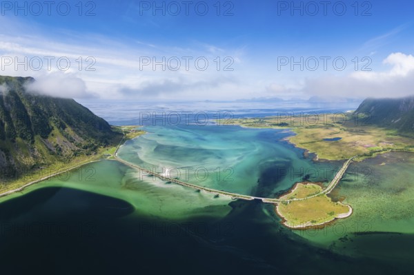 Fjord and mountains of the island Austvågøya, road on dam, Grunnførfjorden, Lofoten, Norway, Europe