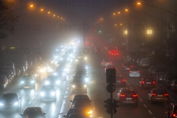 Dense fog, with visibility sometimes less than 100 metres, city centre traffic at rush hour on