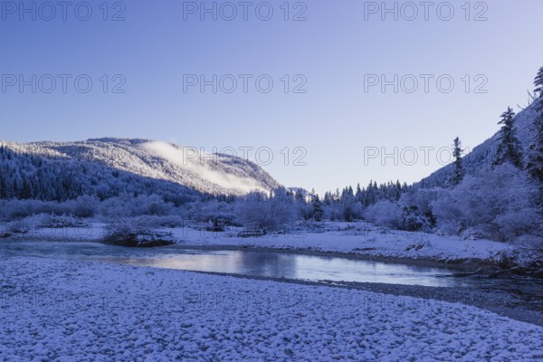 Isar valley in winter at temperatures of minus 18 degrees Celsius. Snow covered landscape with the