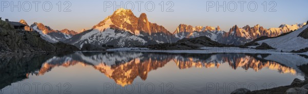 Evening mood, mountain landscape at sunset, alpenglow, water reflection in Lac Blanc with mountain