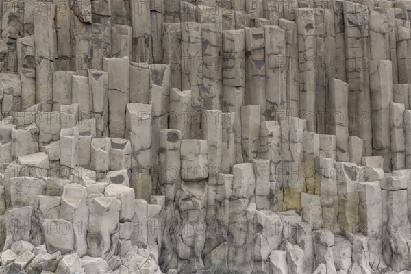 Reynisfjara Beach with Basalt rocks (Stuolabrrg) and the rock needles (Haidrangur), close to Vik i