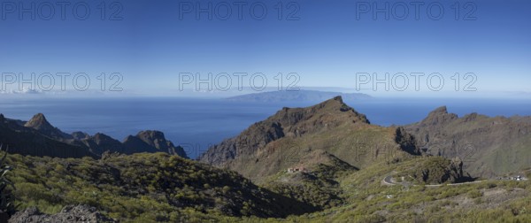 Volcanic rock formation and the Masca Gorge, Barranco de Masca, Teno Mountains, Tenerife, behind La