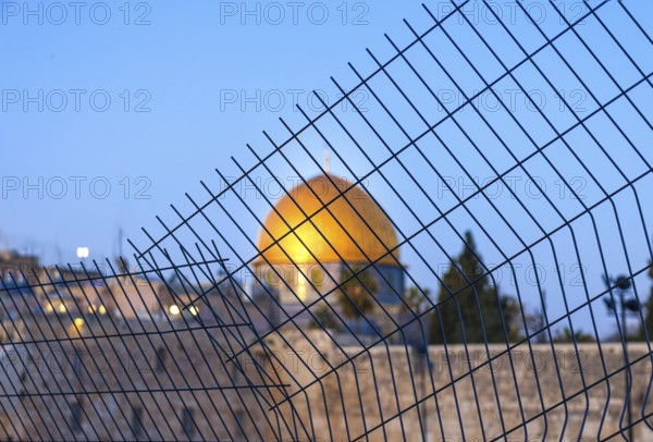 Islamic shrine Dome of Rock in the Old City seen through the fence. Symbol of Palestinian