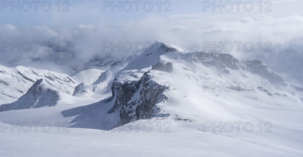 Snow-covered mountain landscape on the Wildhorn, cloudy mood, high tour, Bernese Alps, Bernese