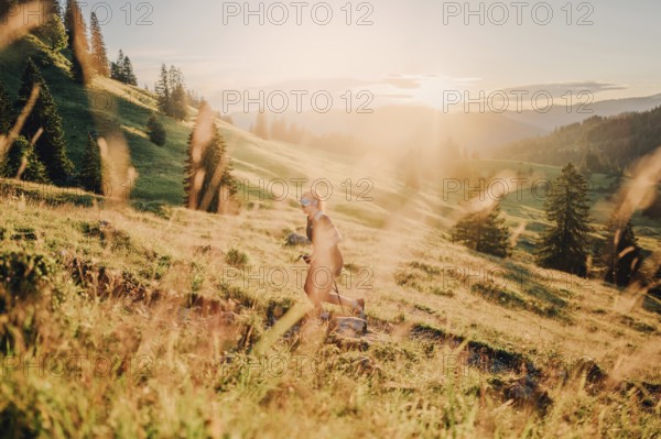 Summer trail running and hiking in the Alps on the Riedberg Pass between Obermaiselstein and