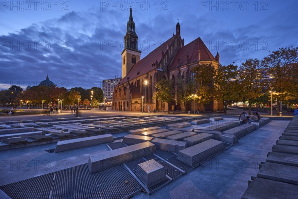 Water cascades and St. Mary's Church with trees at dusk, Karl-Liebknecht-Straße, Berlin, capital