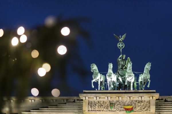 A banner For Democracy in Syria / Defend Rojava hangs at the Brandenburg Tor, Berlin, 16 December