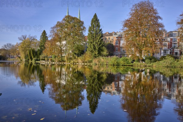Mill pond with trees, general development, reflections on the water surface, Hanseatic city of