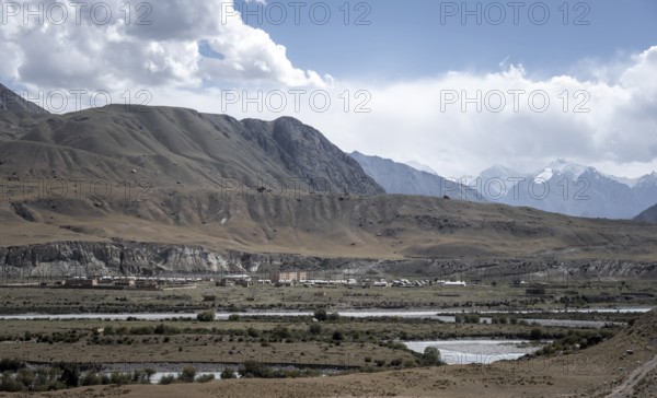 Town view, Engilchek river with village in mountain landscape, ghost town, Engilchek, Tian Shan,
