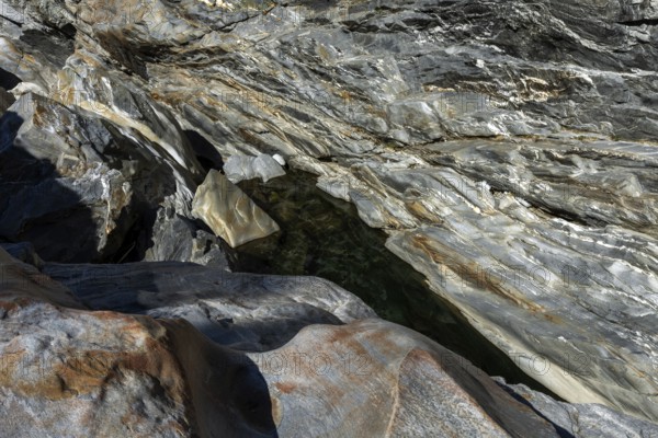 Rocks, granite rock formations in the Maggia River near Ponte Brolla, in the Maggia Valley, Valle
