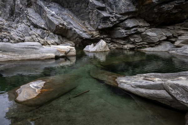 Rocks, granite rock formations in the Maggia River near Ponte Brolla, in the Maggia Valley, Valle