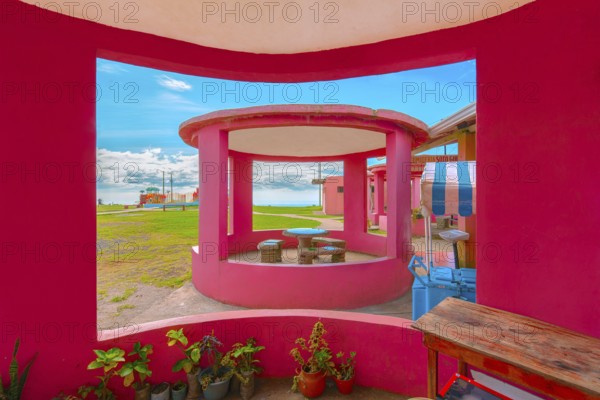 Vibrant Pink Gazebo with Scenic Outdoor Views. Colorful Kiosk in a Tranquil Garden Retreat