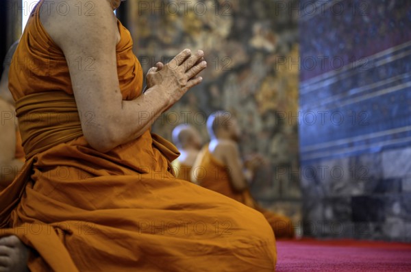 Buddhist monks at prayer, Wat Pho, Temple of the Reclining Buddha, Bangkok, Thailand, Asia