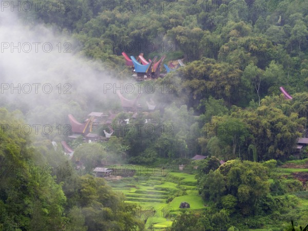 Tropical mountain landscape with traditional villages and rice paddies, Tana Toraja, Sulawesi,