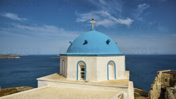 Blue church tower with sea view and clear sky, traditional Greek design, Church of Agios Georgios,