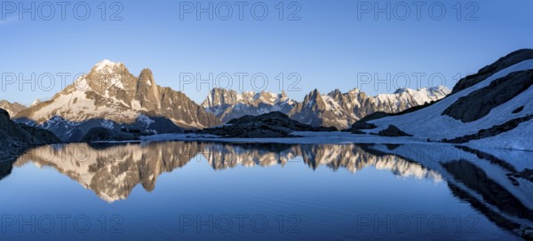 Mountain landscape in the evening light, water reflection in Lac Blanc, mountain peak, Aiguille