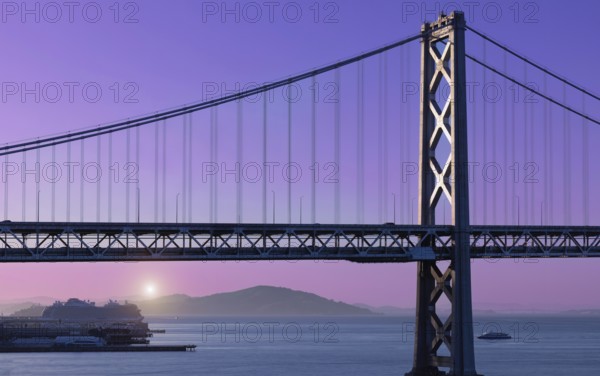 Cruise ship docked near panoramic San Francisco financial skyline near Oakland Bay Bridge