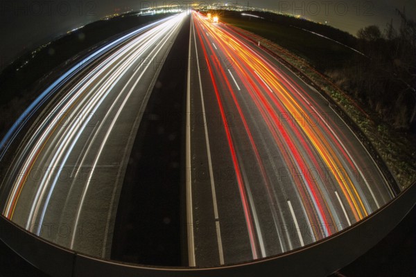 A7 Motorway, Autobahn, beside Kassel at night with light trails from the traffic headlights and