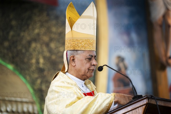 Archbishop John Moolachira leads a prayer during a Christmas day sermon on December 25, 2024 in