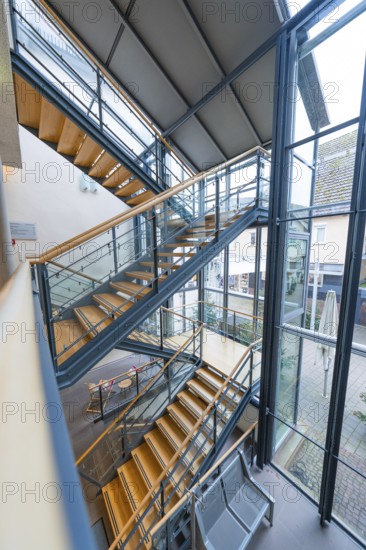 Modern, steel staircase in an urban building with large glass walls, Nagold Town Hall, Black