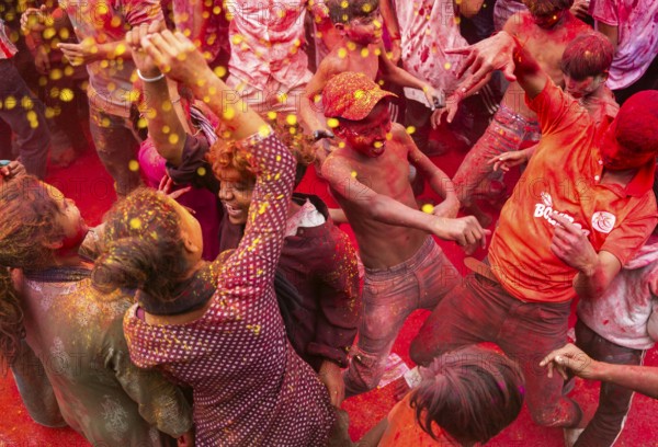 Revellers smear with Gulal or coloured powder and dance to play Holi, the Hindu spring festival of