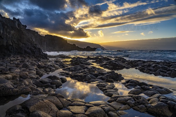 Sunset at the natural swimming pool La Maceta, El Hierro, Canary Islands, Spain, Europe
