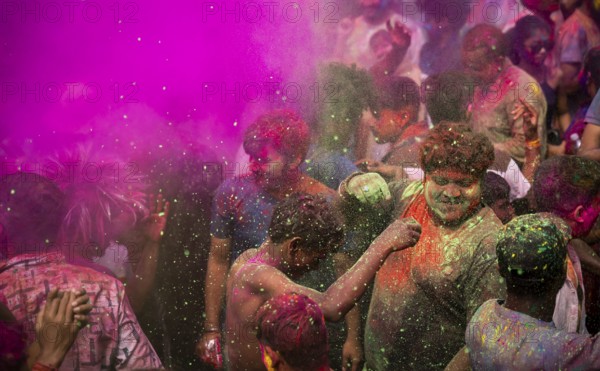 Revellers smear with Gulal or coloured powder and dance to play Holi, the Hindu spring festival of