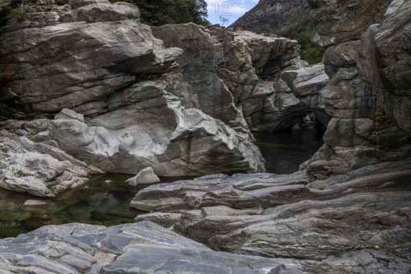 Rocks, granite rock formations in the Maggia River near Ponte Brolla, in the Maggia Valley, Valle