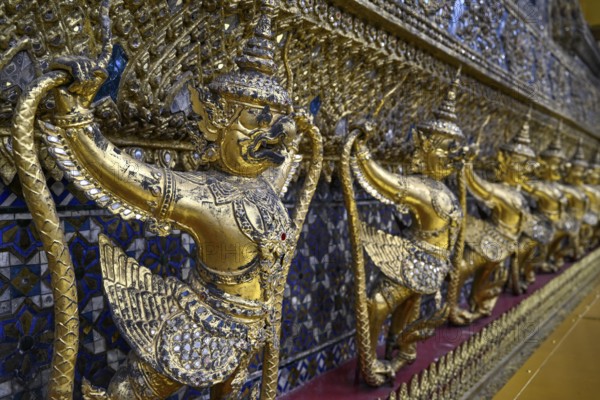 Golden sculptures of Garuda and Naga, Wat Phra Kaew, Temple of the Emerald Buddha, Bangkok,