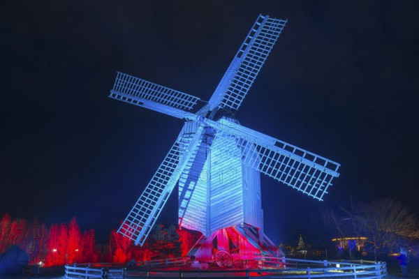 Illuminated windmill with red and blue effects at night, world of lights, illumination, mill