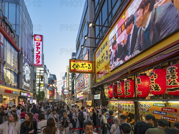 Night-time street with neon lights and illuminated signboards, Dotonbori district, Osaka, Japan,