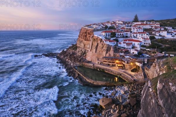 Scenic view of the seaside Azenhas do Mar fishing village on cliff on Atlantic ocean coast,
