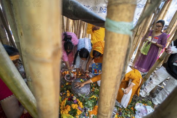 Devotees offer prayers to a Shiva linga on the occasion of Maha Shivaratri, on February 26, 2025 in