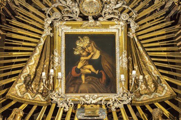 Image of the Virgin Mary on the altar of the baroque parish church Mariahilfer Kirche in Vienna,