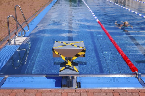 Hagen, North Rhine-Westphalia, Germany - Blocked-off starting block at the edge of the swimming