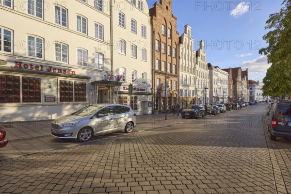 Hotel Jensen, historic houses, street An der Obertrave made of concrete paving stones, Hanseatic