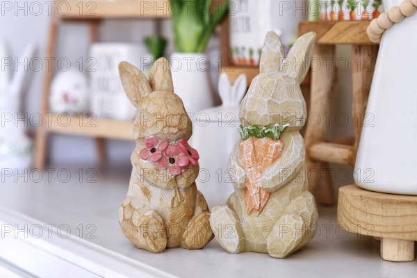 Pair of cute rustic Easter bunny decoration with flowers and carrots