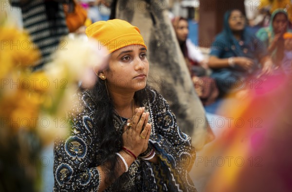 Sikh devotees offer prayers at a Gurudwara on the occasion of Guru Nanak Jayanti, in Guwahati,